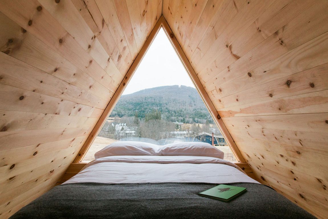 A tent style cabin with a view of the mountains