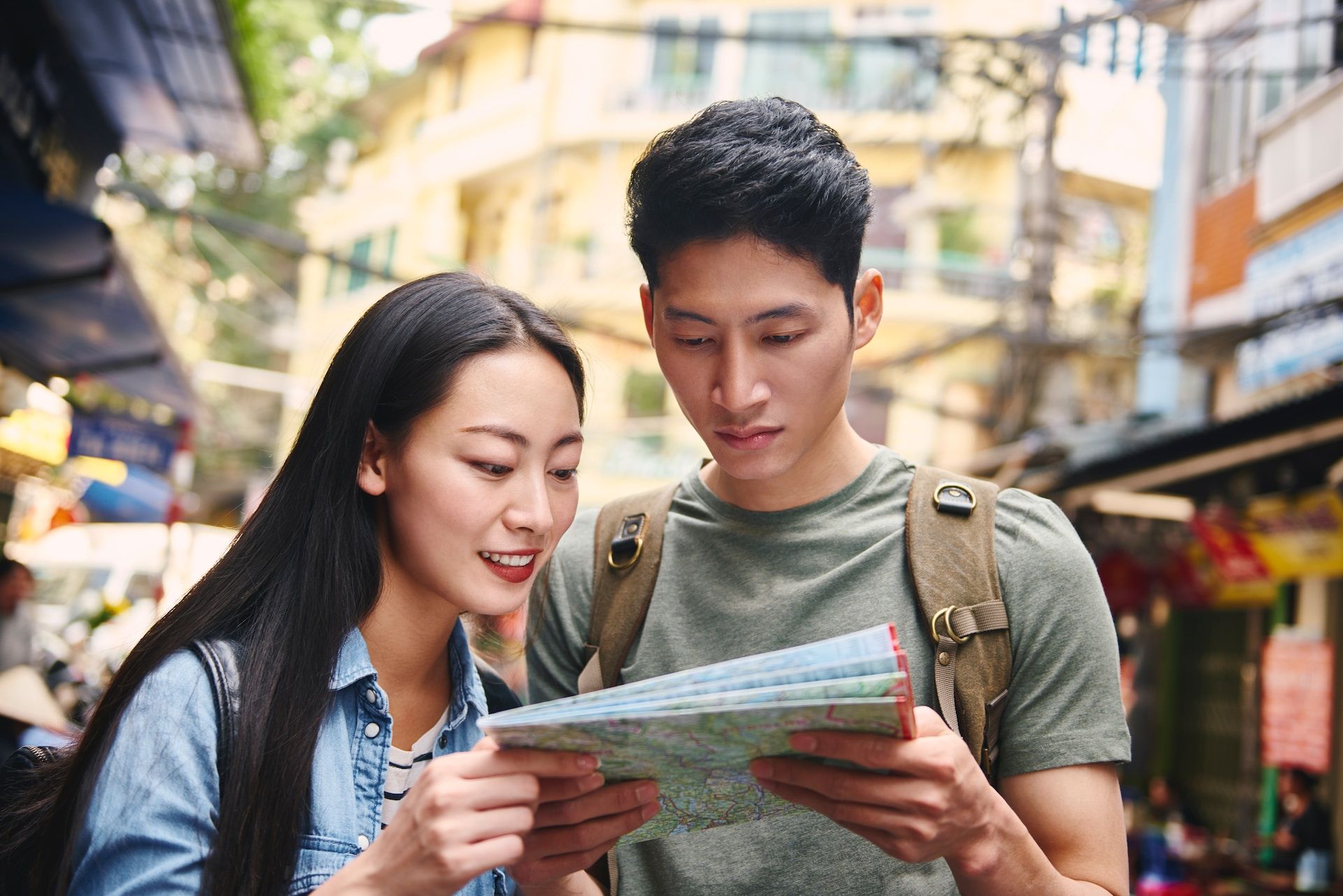 man and woman reading a map