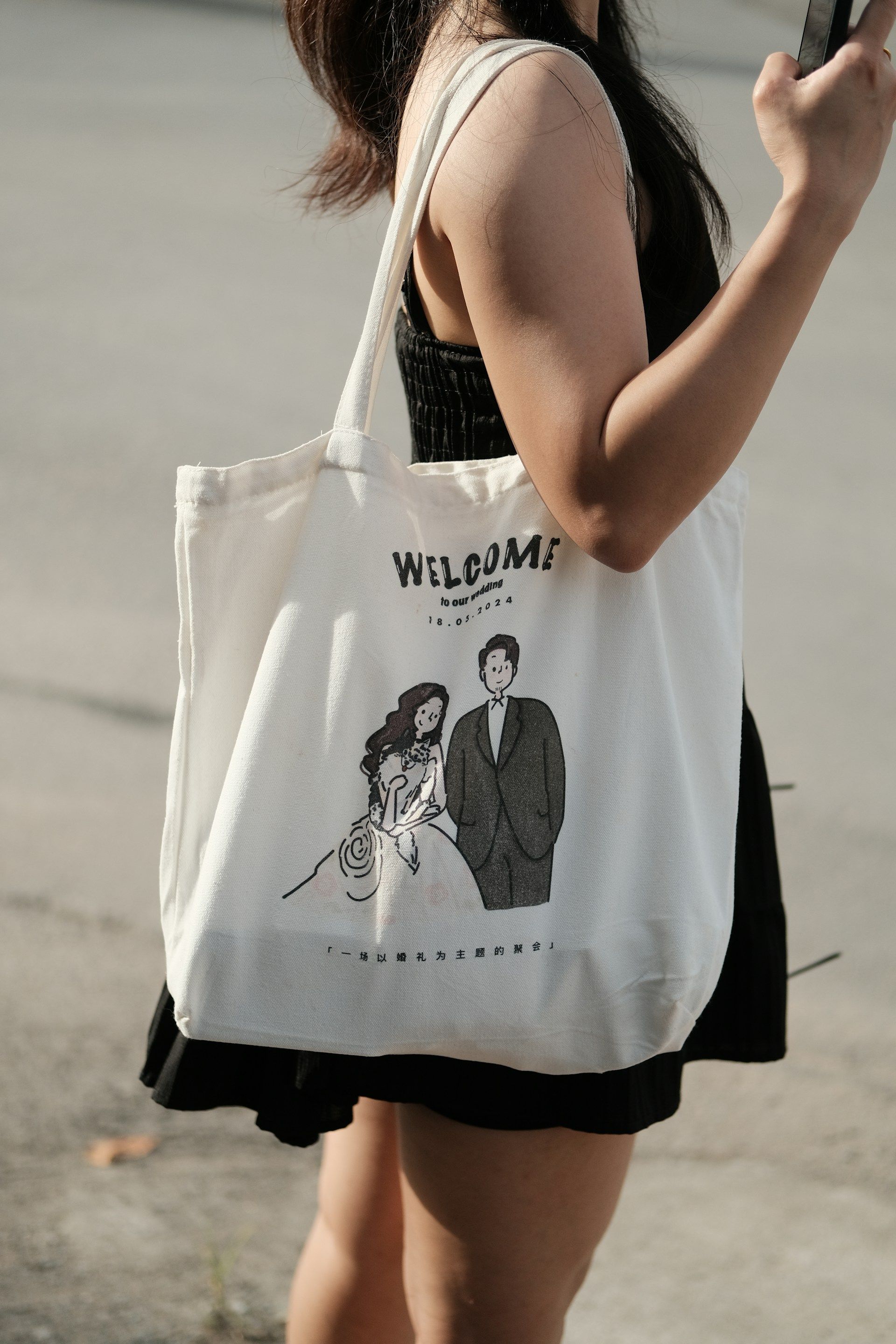Canvas tote bag featuring a wedding welcome illustration.